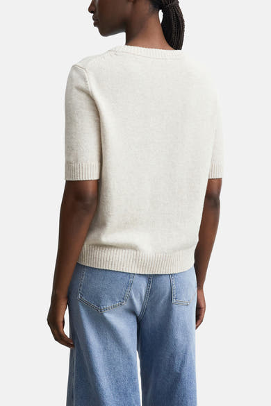 Beige short-sleeve crewneck sweater by COMMA, ribbed cuffs and hem, back view on model wearing light blue jeans