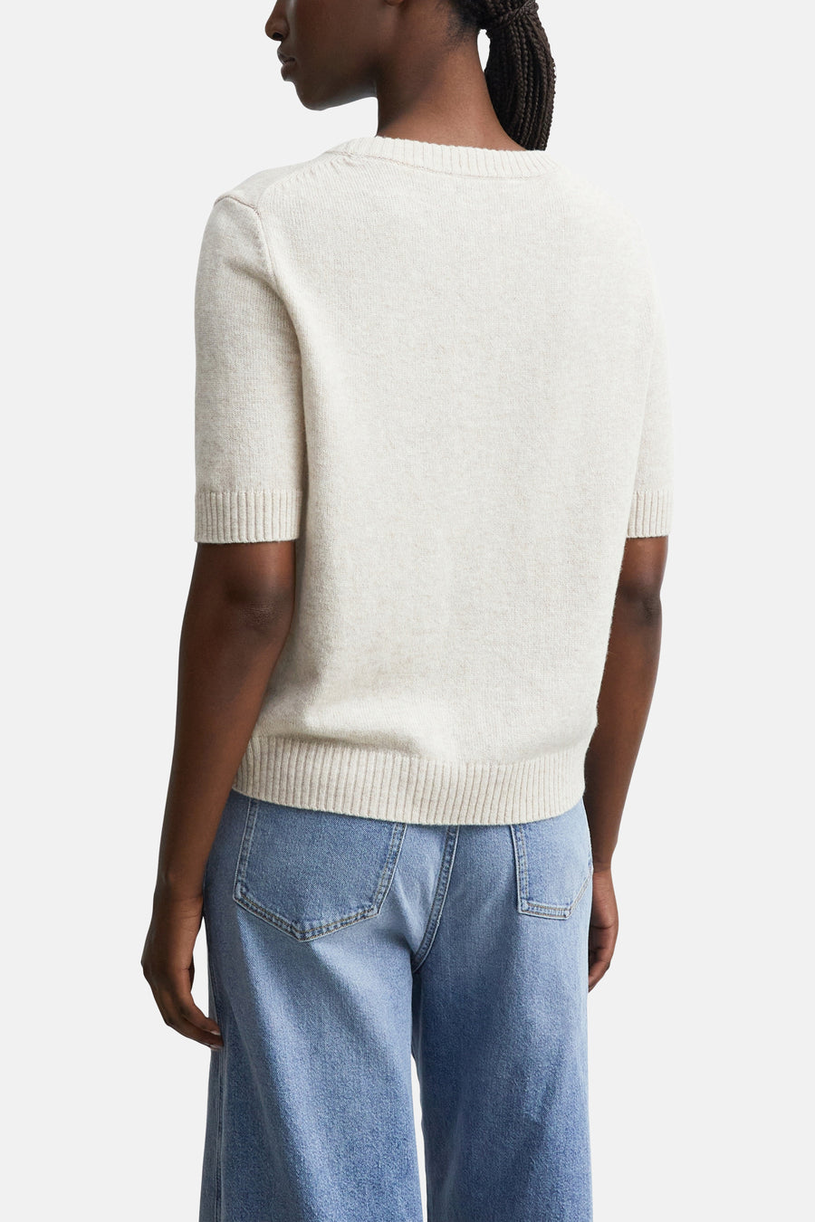 Beige short-sleeve crewneck sweater by COMMA, ribbed cuffs and hem, back view on model wearing light blue jeans