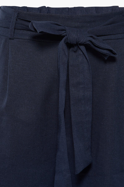 Navy blue shorts with tie waist and textured fabric, front close-up view