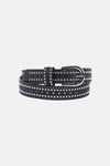 Ceinture noire en cuir, de Morgan de Toi, avec clous décoratifs argentés et perforations.