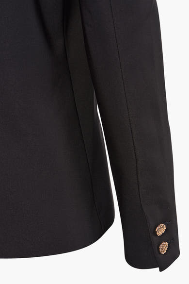 Zwarte blazer van Morgan de Toi met twee decoratieve gouden knopen op de mouw, getailleerde pasvorm.