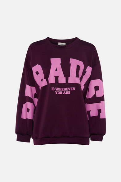 Dark purple crewneck sweatshirt with bold pink "BABY IS WHEREVER YOU ARE" graphic, by Toga Pulla, front view