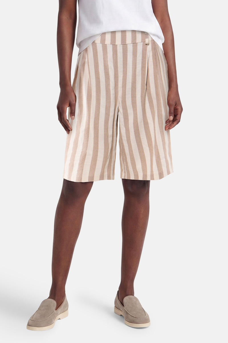 Beige striped women's shorts with elastic waist, front view, worn with white top and beige loafers