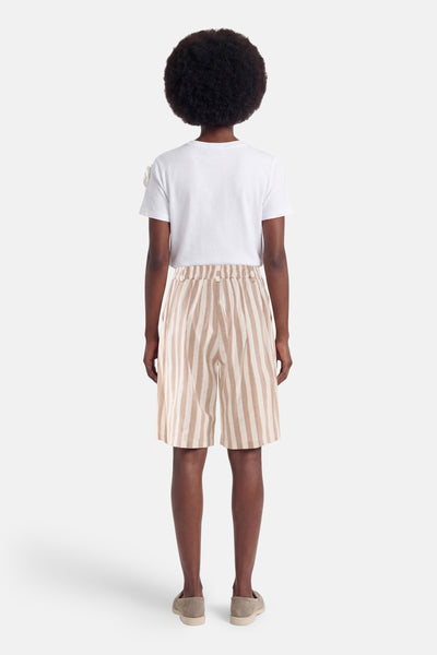 Beige striped short with elastic waist, back view, worn with white t-shirt and beige loafers