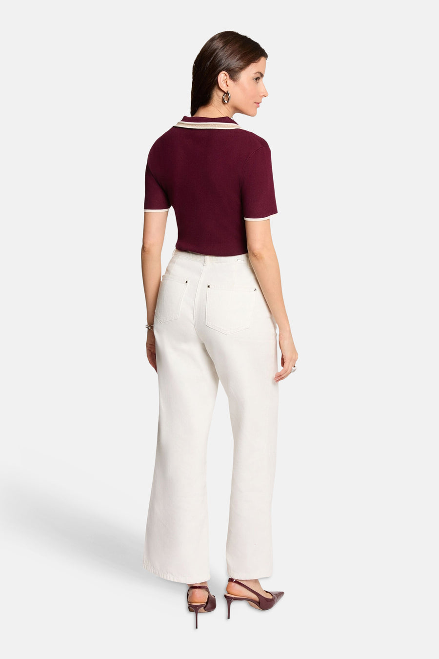 Bordeaux short-sleeve cardigan with cream trim, back view, paired with white wide-leg pants and burgundy heels