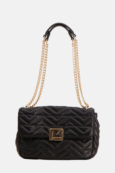 Sac à main noir de Morgan de Toi avec chaîne dorée et motif matelassé en chevrons.