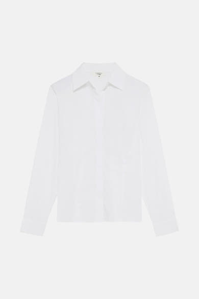 Chemise blanche à manches longues de CAROLL, classique et élégante, présentée à plat.
