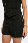 Short noir en tweed de Morgan de Toi avec détails de poches, fermeture éclair latérale et bracelet argenté.
