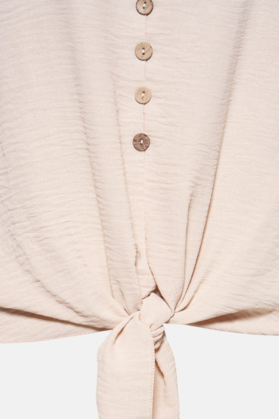 Beige T-shirt met korte mouwen van Terra di Siena met houten knopen en een strik.