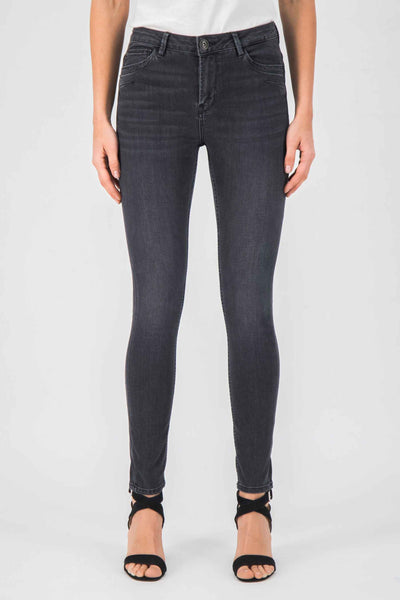 Slim-fit gray jeans with subtle texture, front view on model wearing white top and black strappy heels