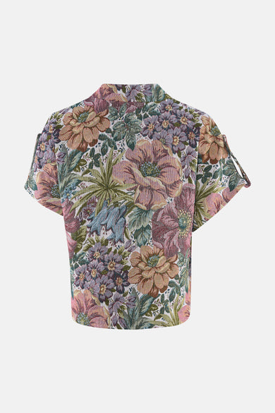 Gilet multicolore de Terra di Siena, à motif floral, manches courtes avec détails de lanières et texture tissée.
