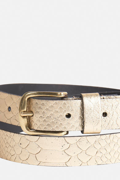 Ceinture dorée imitation peau de serpent de Legend, avec une boucle ardillon en métal doré.