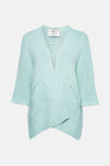 Gilet turquoise en maille, de Terra di Siena, avec des poches plaquées et une coupe croisée.
