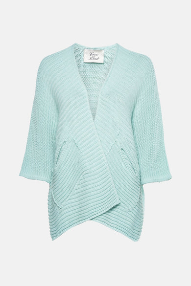 Gilet turquoise en maille, de Terra di Siena, avec des poches plaquées et une coupe croisée.

