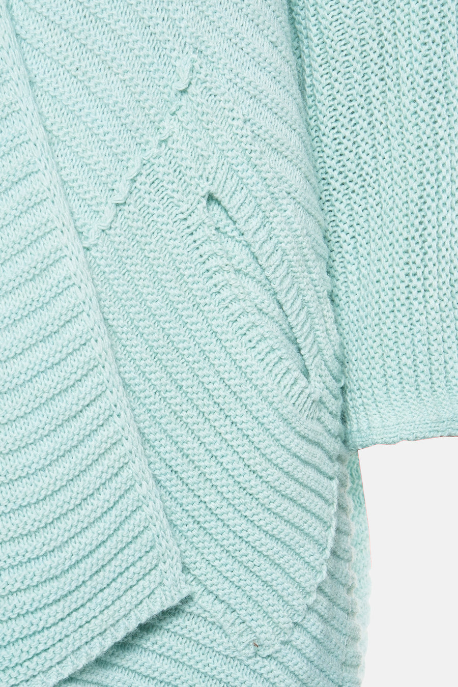 Gilet turquoise de Terra di Siena, tricoté avec motif texturé et manches amples.