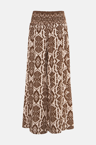 Pantalon ample marron Terra di Siena, à motifs ikat, avec taille smockée et élastiquée.
