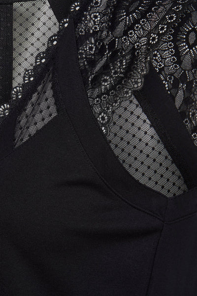 Top noir sans manches de Morgan de Toi avec dentelle florale et tulle à pois.
