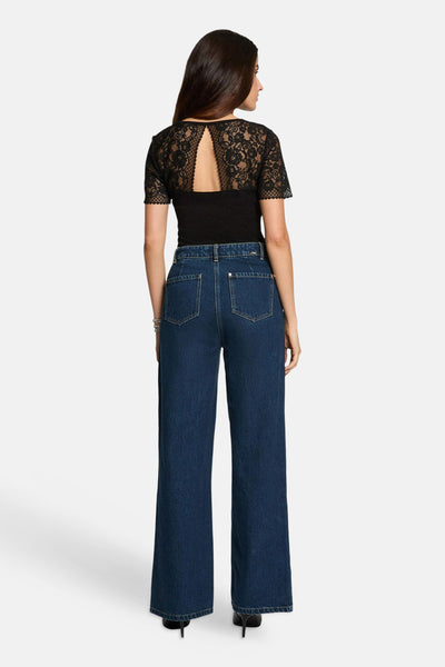 Black short-sleeve t-shirt with lace back and keyhole detail, worn with dark blue wide-leg jeans, back view