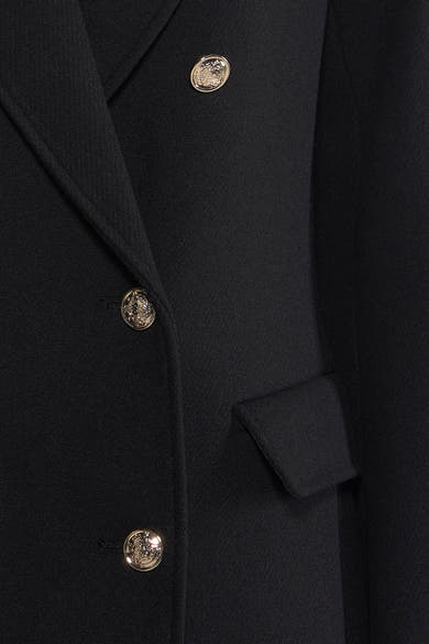 Veste noire par Morgan de Toi avec boutons dorés et poche discrète, style élégant.