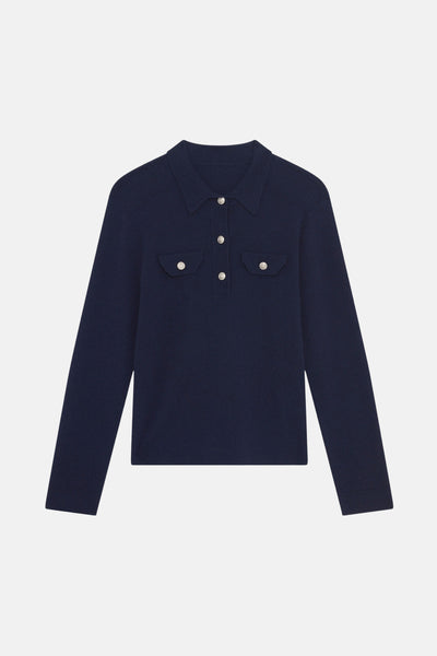 Donkerblauwe trui van CAROLL met lange mouwen, borstzakken met knopen en polokraag.