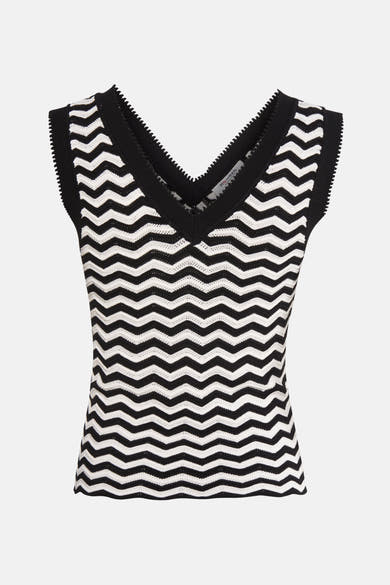 Top sans manches noir et blanc à motif zigzag, de Morgan de Toi, avec encolure en V noire.
