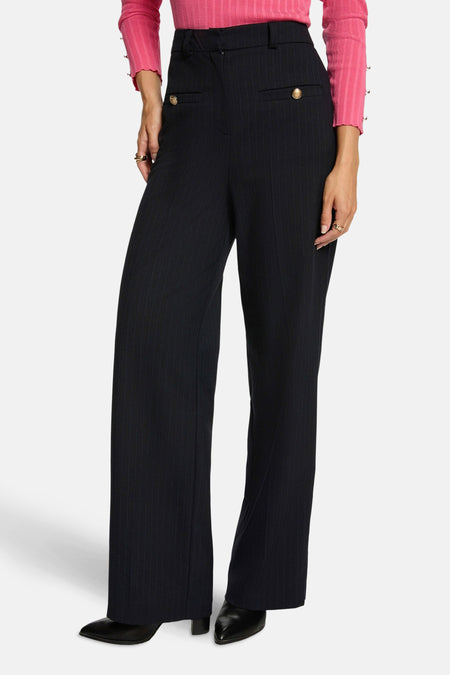 Marineblauwe krijtstreep pantalon van Morgan de Toi met gouden knoopdetails.