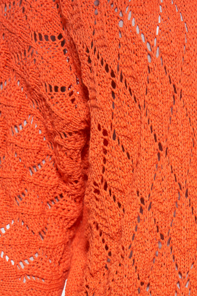 Oranje gilet van Terra di Siena, textuur gebreid met ruitpatronen.