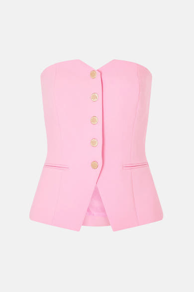 Gilet rose de Morgan de Toi, modèle bustier avec une rangée de boutons dorés et des fausses poches à rabat.