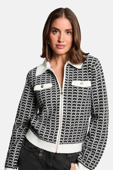 Zwarte geruite cardigan met rits van Morgan de Toi, met witte kraag en afwerkingen, decoratieve borstzakken.
