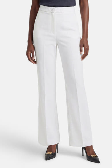 Witte pantalon van Morgan de Toi, wijde pasvorm met bloemenborduursel op de tailleband.