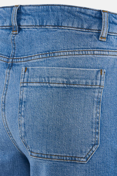 Jean large en denim bleu moyen de CAROLL, avec poche arrière carrée et passants de ceinture.
