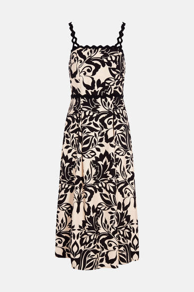 Zwart-crème midi-jurk van Morgan de Toi, met bloemenprint, geschulpte bandjes en een geplooide rok.