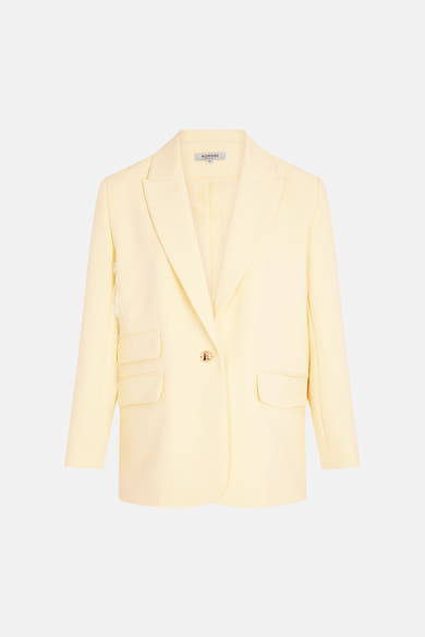 Blazer jaune, par Morgan de Toi, avec une boutonnière dorée et des poches plaquées.