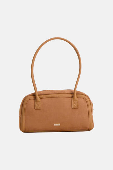 Cognac suede handbag with rounded top handles and front plaque, by Filippa K, shown front view on white background
