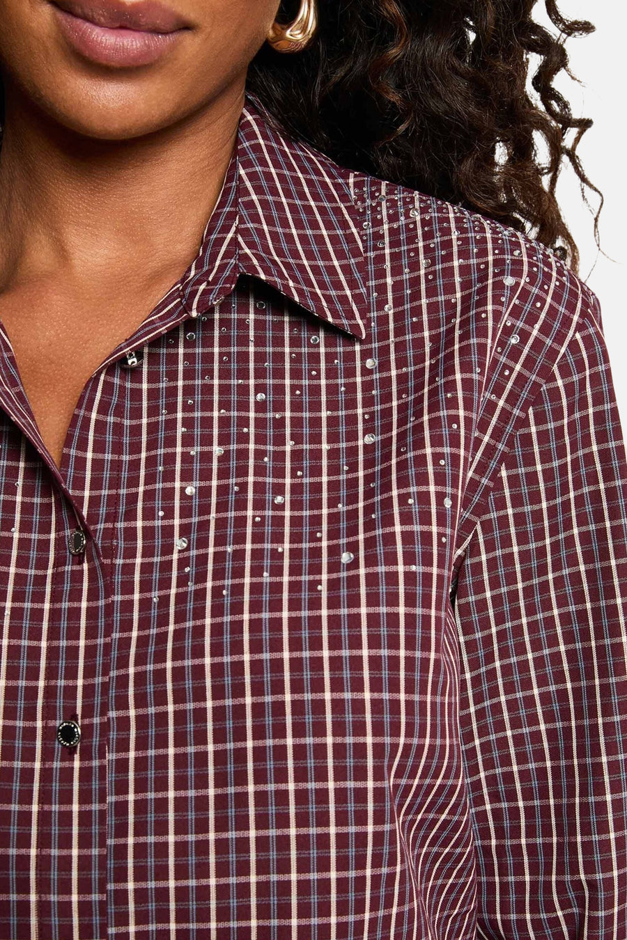 Burgundy plaid long-sleeve blouse with silver studs and button-down collar, close-up front view