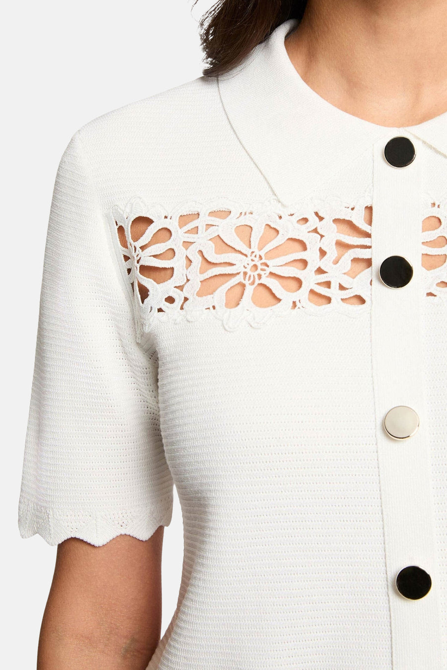 White O-neck knit sweater with floral lace panel and contrast buttons, close-up front view