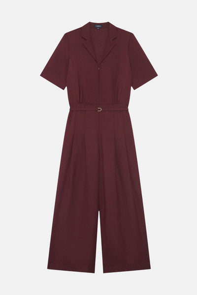 Bordeaux short-sleeve jumpsuit by Caroll with notched collar, front zipper, and belted waist, featuring wide-leg trousers in smooth fabric, front view