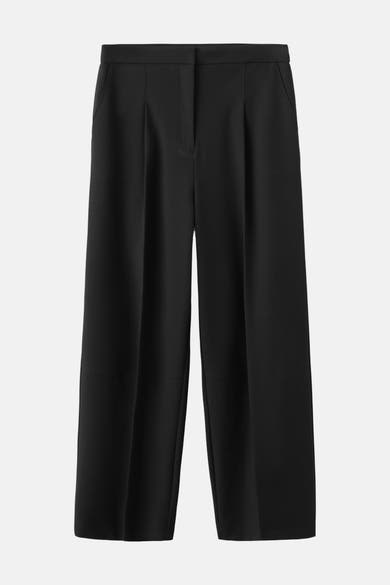 Zwarte broek van MANGO, losse pasvorm en wijde pijpen, met zijzakken.