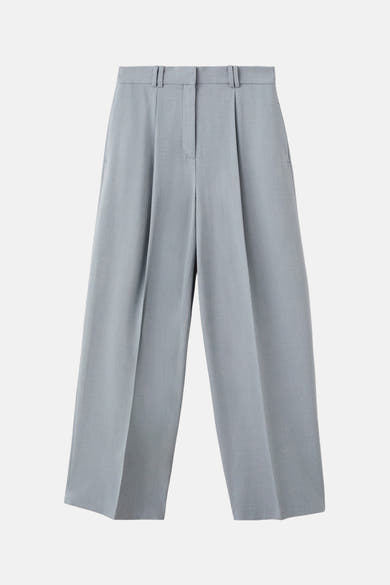 Blauwe pantalon van MANGO, wijde pasvorm met plooien aan de voorkant.