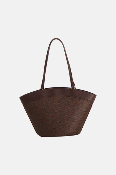 Sac à bandoulière brun de MANGO avec corps en matière tissée et anses lisses.