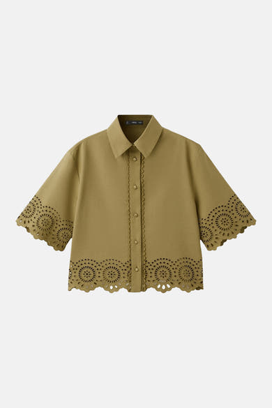 Kaki blouse van MANGO met ronde broderie anglaise en geschulpte randen aan de mouwen en zoom.