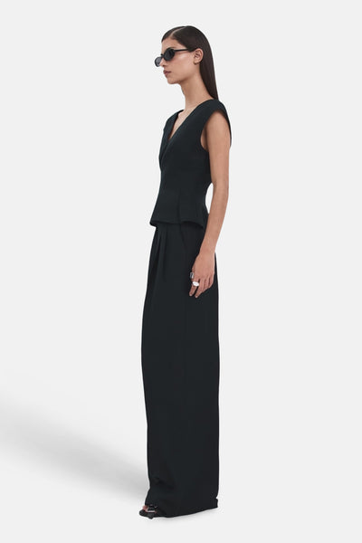 Pantalon bleu par MANGO, coupe large et ample, avec des plis sur le devant.