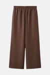 Bruine broek van MANGO met geplooide elastische tailleband en centrale naad, in getextureerde stof.