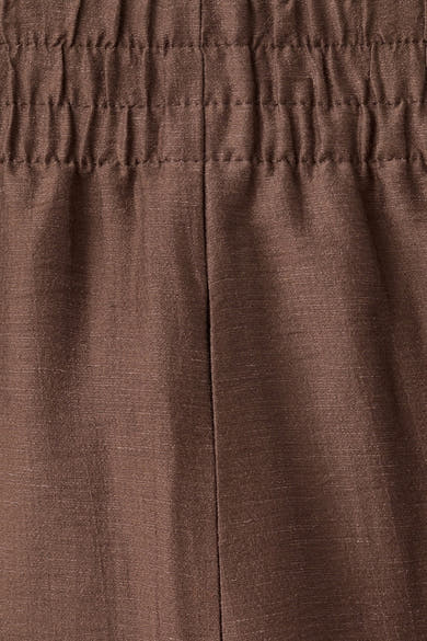 Pantalon brun de MANGO à taille élastiquée froncée et couture centrale, en tissu texturé.