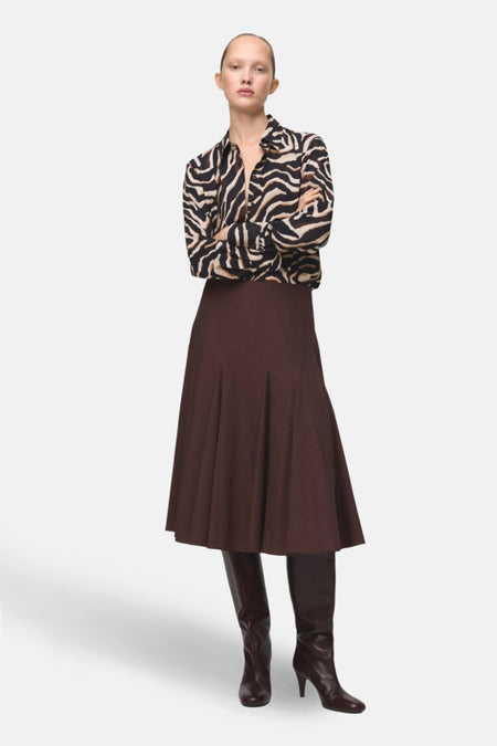 Chemisier à manches longues multicolore de MANGO, avec un motif zébré marron et noir.