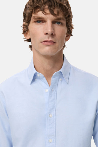 Blauw overhemd met lange mouwen van MANGO, met knoopsluiting en een geknoopte kraag.