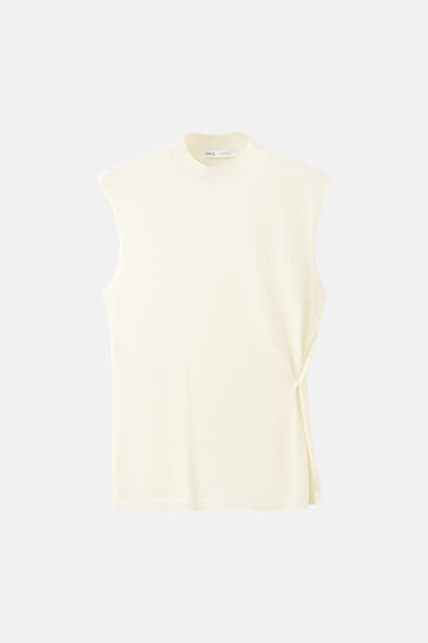 Beige mouwloze top van MANGO, met een strikdetail aan de zijkant.