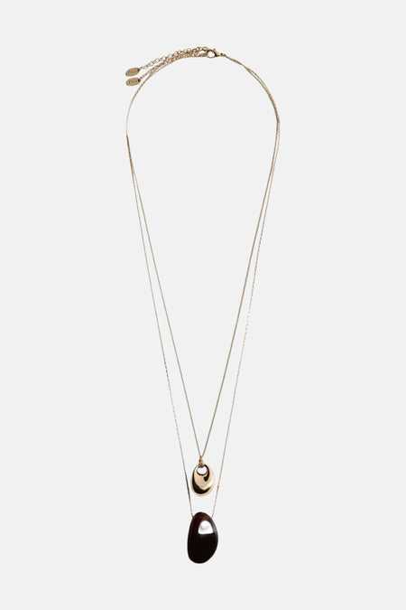 Collier court doré de MANGO, à double chaîne avec pendentifs ovales texturés.
