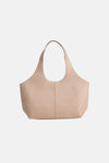 Beige schoudertas van MANGO, met dubbele bovenhandgreep en korrelige textuur.