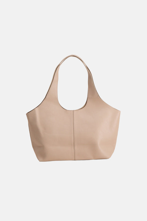 Sac à bandoulière beige de MANGO, avec double anse supérieure et texture grainée.